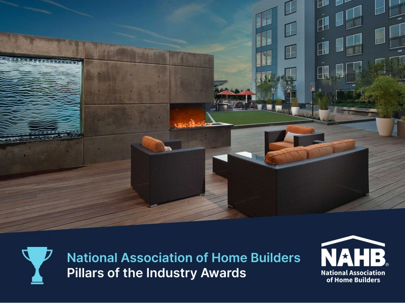 Outdoor lounge at Halstead Square with modern fireplace and waterfall wall feature