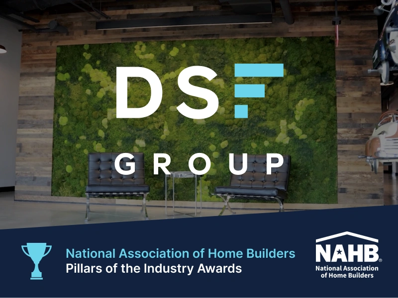 Lobby with modern rustic decor, DSF Group branding in NAHB Pillars of the Industry award graphic
