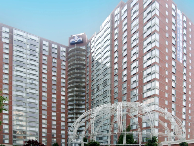 High-rise apartment complex with curved glass tower at La Rochelle Apartments