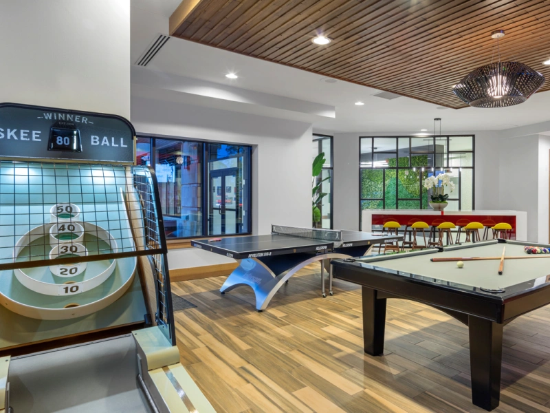 Game lounge featuring skee-ball, ping pong table and pool table at Halstead Malden Square