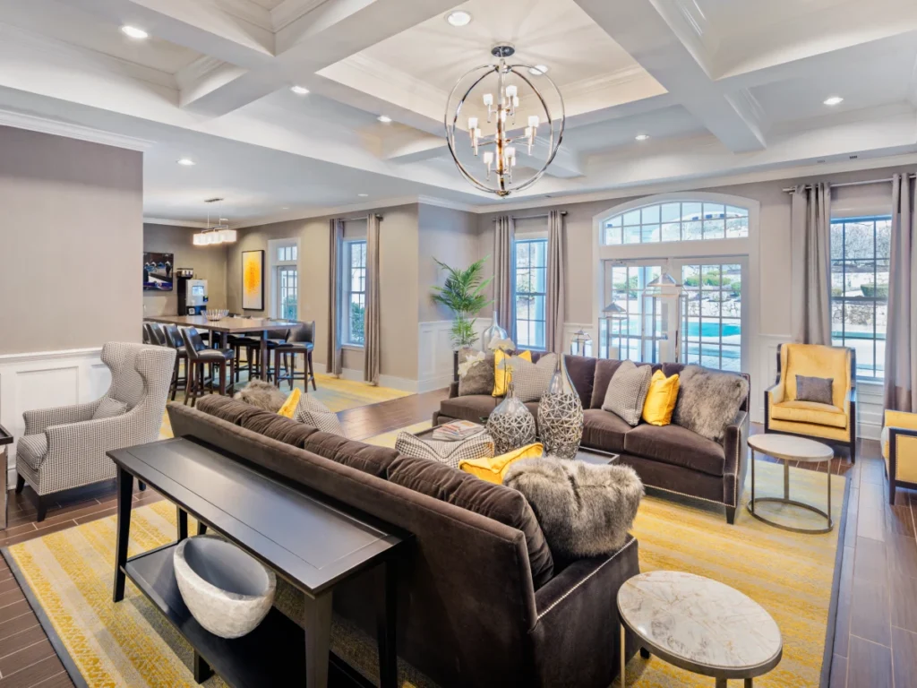 Elegant clubhouse interior with modern chandeliers and cozy seating in Halstead Westborough