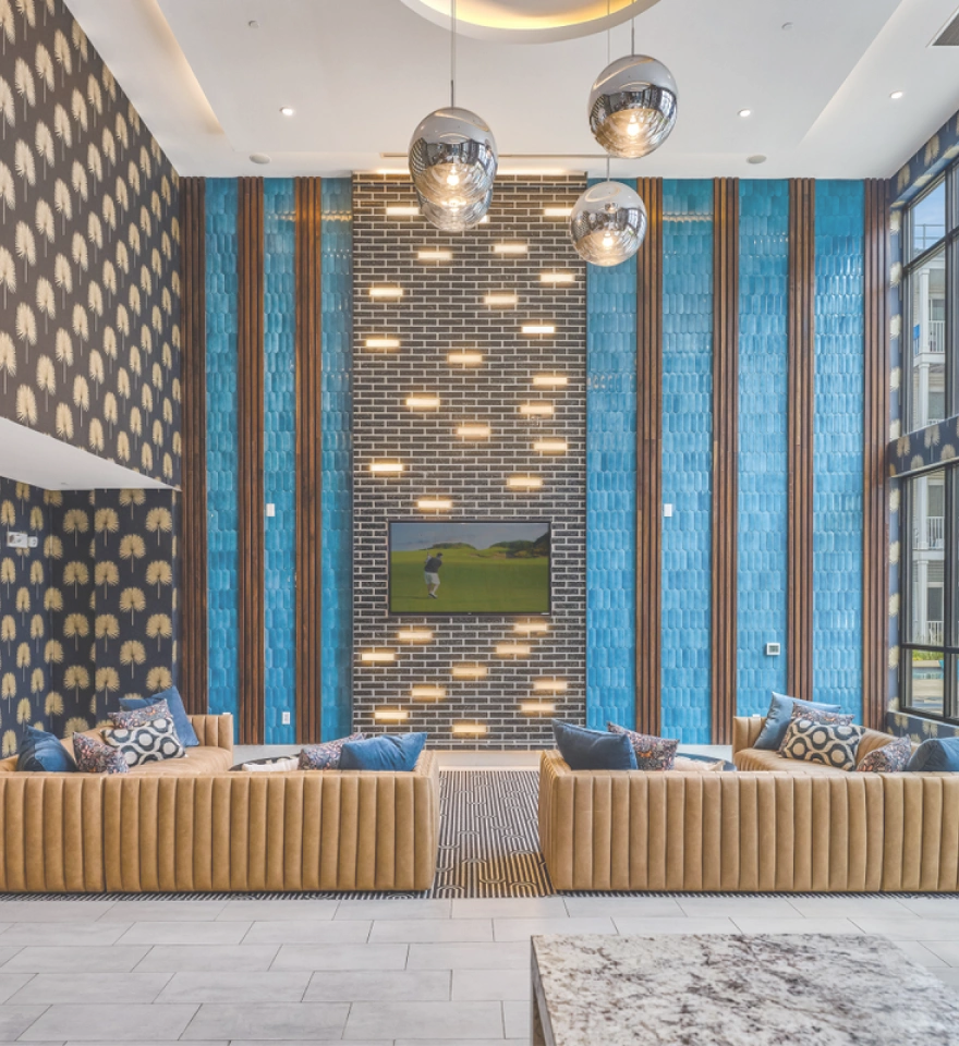 Contemporary hotel lobby interior with contemporary accents and sleek blue brick feature wall