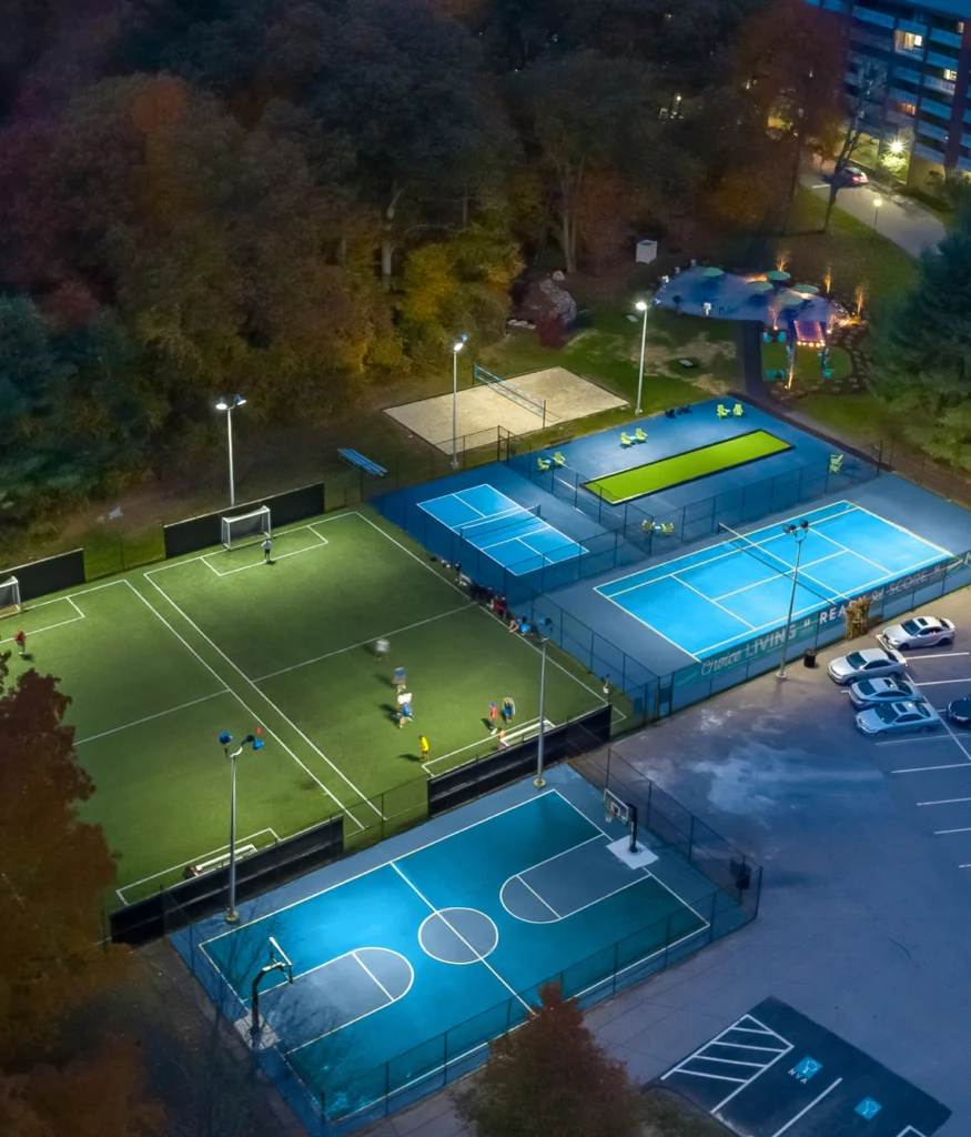 Outdoor sports complex with illuminated soccer, basketball, and tennis courts in Halstead Danvers