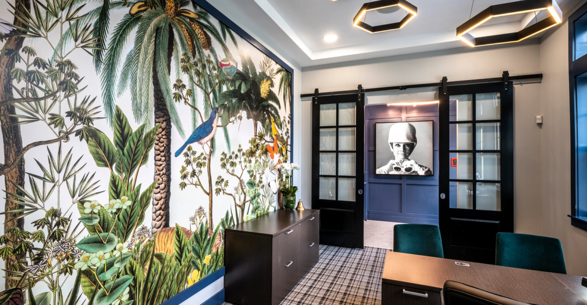 Artistic interior office with exotic wildlife mural and contemporary furnishings in shared space