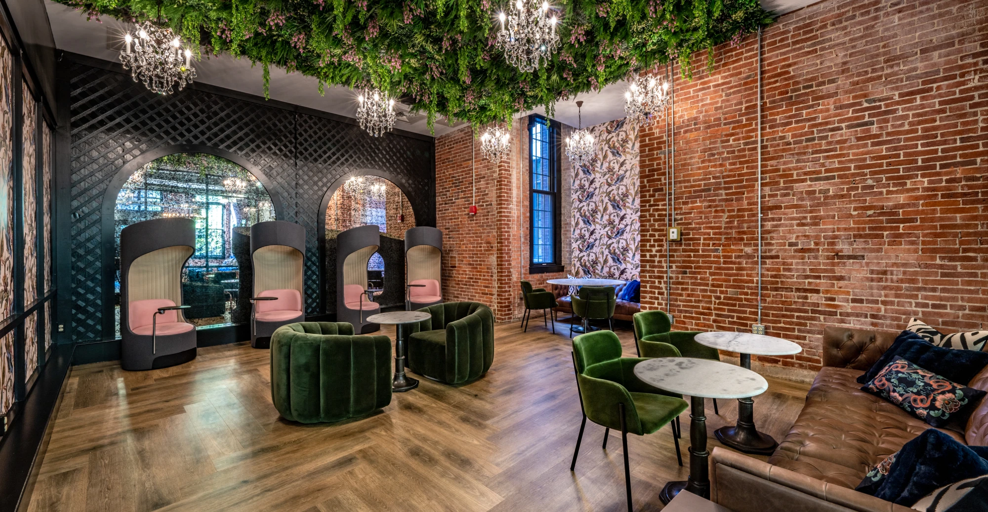 Industrial-chic lounge with greenery ceiling décor, and modern furniture in Halstead Providence